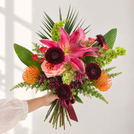 Handheld bouquet with pink lilies, roses, and dark mums