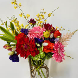Colorful mixed bouquet in a clear glass vase