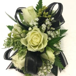 Small bouquet of pale roses with black ribbon accents