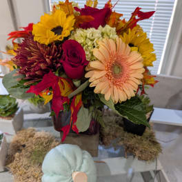 Autumn bouquet with sunflowers, roses, gerbera daisies, and mums