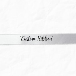 White ribbon with the words "Custom Ribbon" printed on it