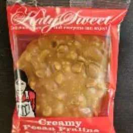 Packaged creamy peanut brittle in a red bag