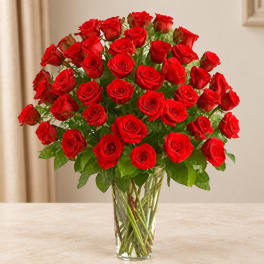 Bouquet of red roses in a clear glass vase