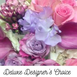 Pink, lavender, and white mixed bouquet with roses and orchids
