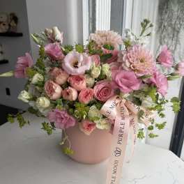 Pink and white mixed flower arrangement in a blush box with a ribbon