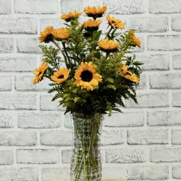 Sunflower arrangement in a clear glass vase