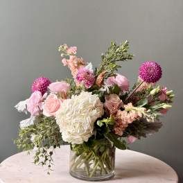Pink and white mixed bouquet in a clear glass vase