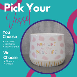 Decorative ceramic planter with pastel text and pink spots