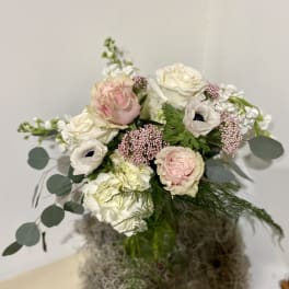 Bouquet of blush and white flowers with round eucalyptus leaves