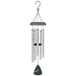 A silver wind chime with hanging metal tubes and a black clapper.