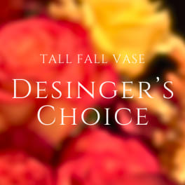Blurred fall floral arrangement with red, orange, and yellow blooms