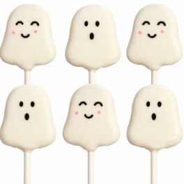 Six ghost-shaped white cake pops with smiling faces on sticks