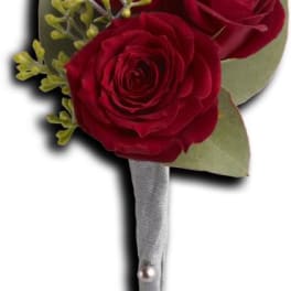 Red rose boutonniere with silver wrap and pearl pins