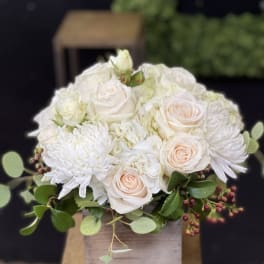 White and blush rose bouquet with white chrysanthemums in a wooden box