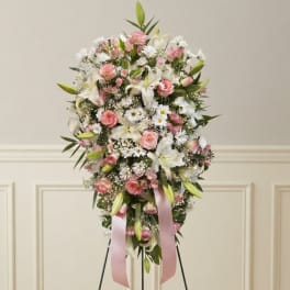 Pink and white floral standing spray with ribbon streamers