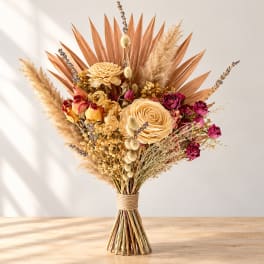 Dried bouquet with cream and magenta flowers tied with twine