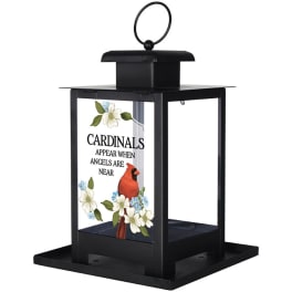 Black lantern with glass panel featuring a red cardinal, white blossoms, and an angel remembrance verse.