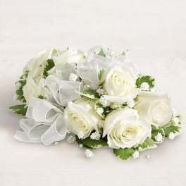 White rose bouquet with baby's breath and a sheer ribbon bow