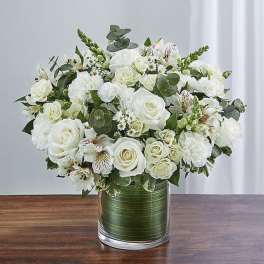 White rose bouquet in a clear glass vase