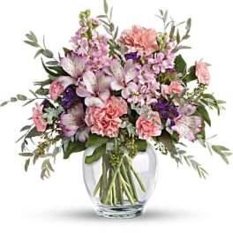 Pink and lavender mixed bouquet in a clear glass vase