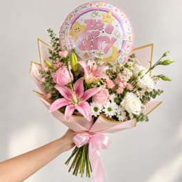 Pink and white bouquet with a "It's a Girl" balloon