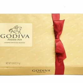 Gold Godiva chocolate gift box with a red ribbon