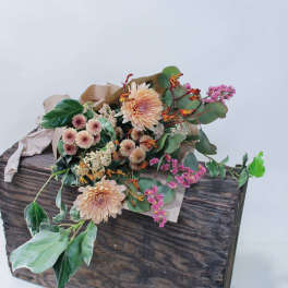 Mixed flower bouquet in a rustic wooden box