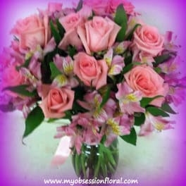 Pink roses and alstroemeria in a glass vase