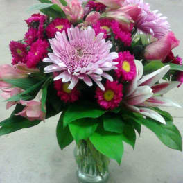 Pink and white mixed bouquet in a clear glass vase