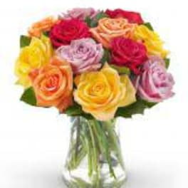 Mixed roses in a clear glass vase