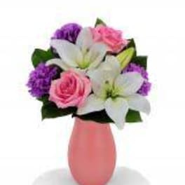 Pink and white flower bouquet in a pink vase