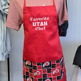 Red apron with "Favorite Utah Chef" text and University of Utah logos