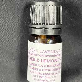 Small amber bottle of lavender and lemon essential oil with a black cap