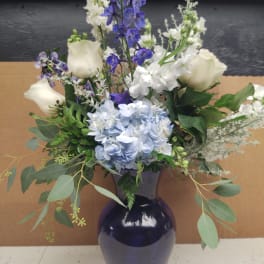 Blue Vase with blue & white flowers