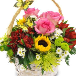 Basket of pink roses, sunflowers, and red blooms with butterfly decorations