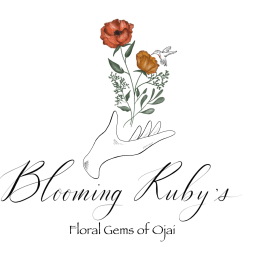 Logo with two orange flowers above a hand and the text Blooming Ruby's
