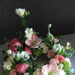 Pink and white floral wreath with roses and lilies