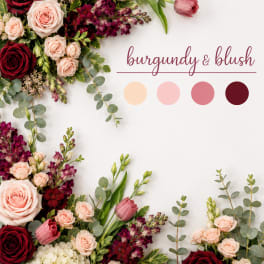 Burgundy and blush floral arrangement with roses, tulips, and hydrangeas