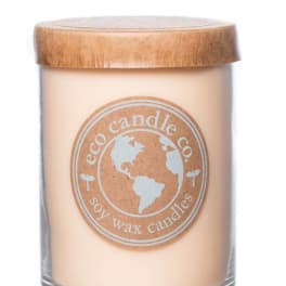 Soy wax candle in a clear glass jar with a wooden lid