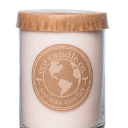 Soy wax candle in a glass jar with a wooden lid