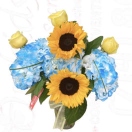 Bouquet of blue hydrangeas with yellow roses and sunflowers in a vase