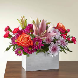 Mixed bouquet with roses, lilies, and daisies in a white box