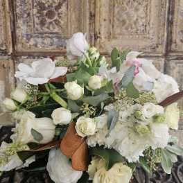 White rose and orchid bouquet with eucalyptus and ribbon