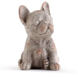 Small gray dog figurine sitting on a white background