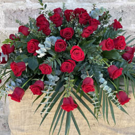 Large bouquet of red roses with eucalyptus and palm fronds