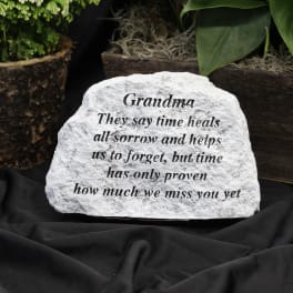 Engraved memorial stone with the word Grandma and a sympathy message
