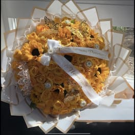 Large yellow rose and sunflower bouquet with white ribbon, jewels, and gold butterfly accents