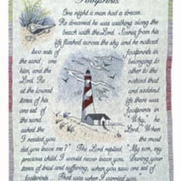 Decorative wall hanging with a lighthouse scene and printed text