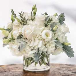 White floral bouquet in a clear glass vase