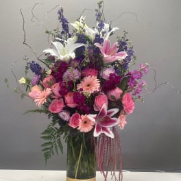 Pink and white mixed bouquet in a gold vase